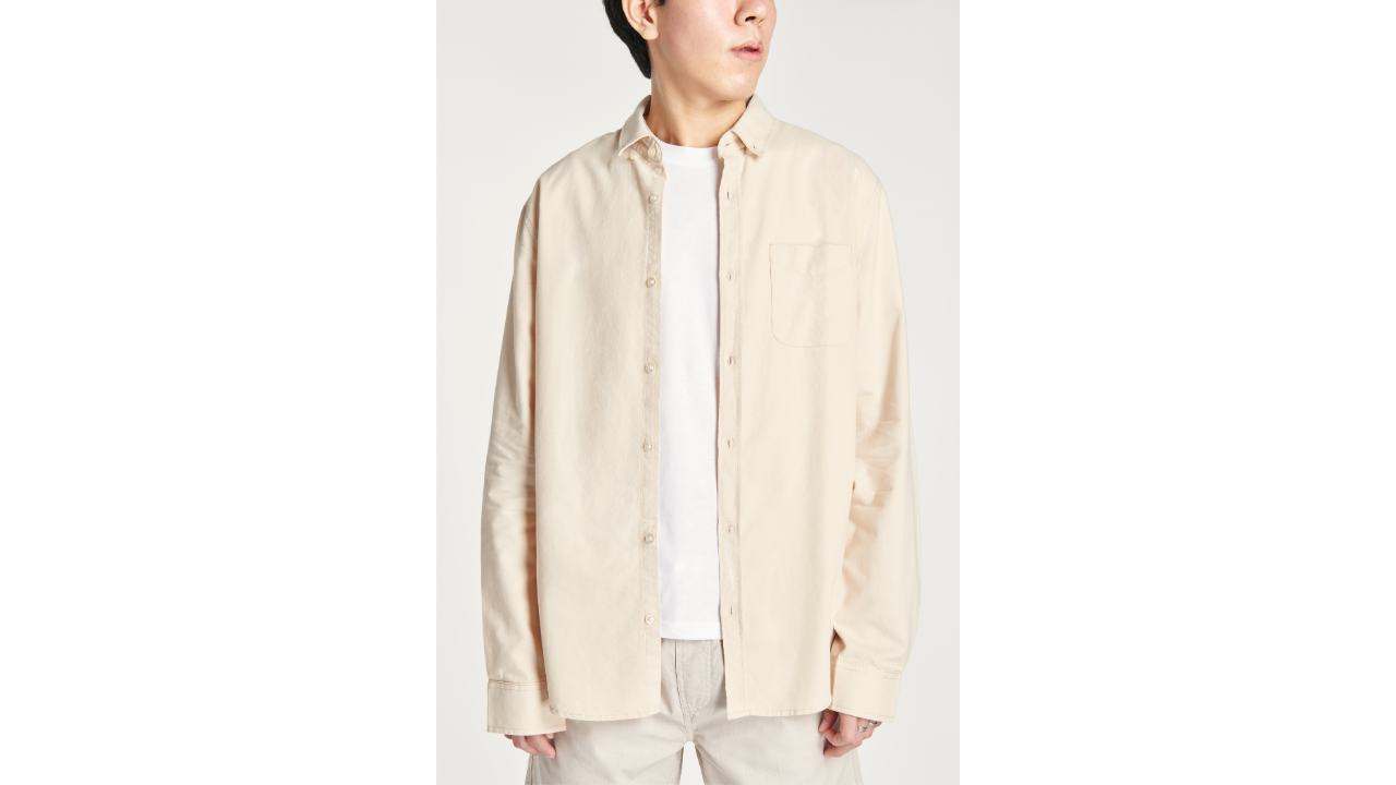 3. Bring in a relaxed button down shirt